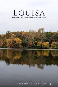 Calm lake reflecting autumn trees in Louisa County.